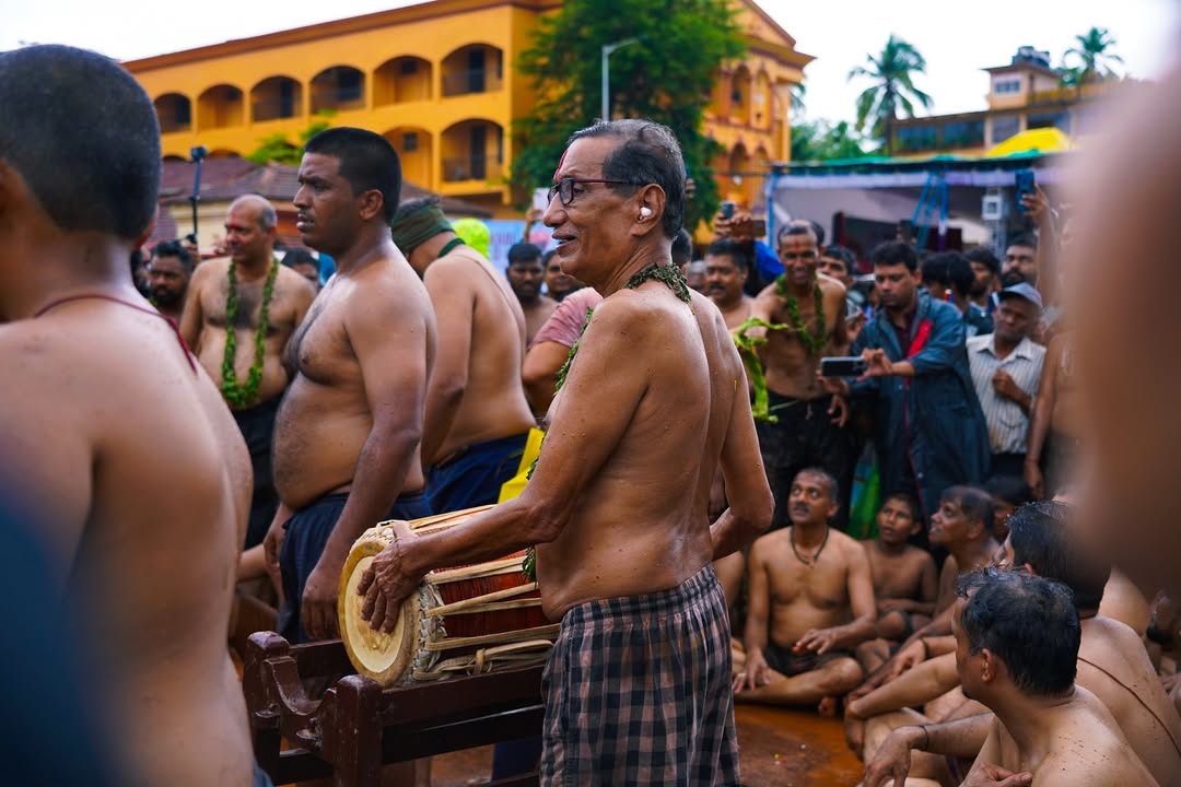 A participant in the Chikhal Kalo plays the traditional drum