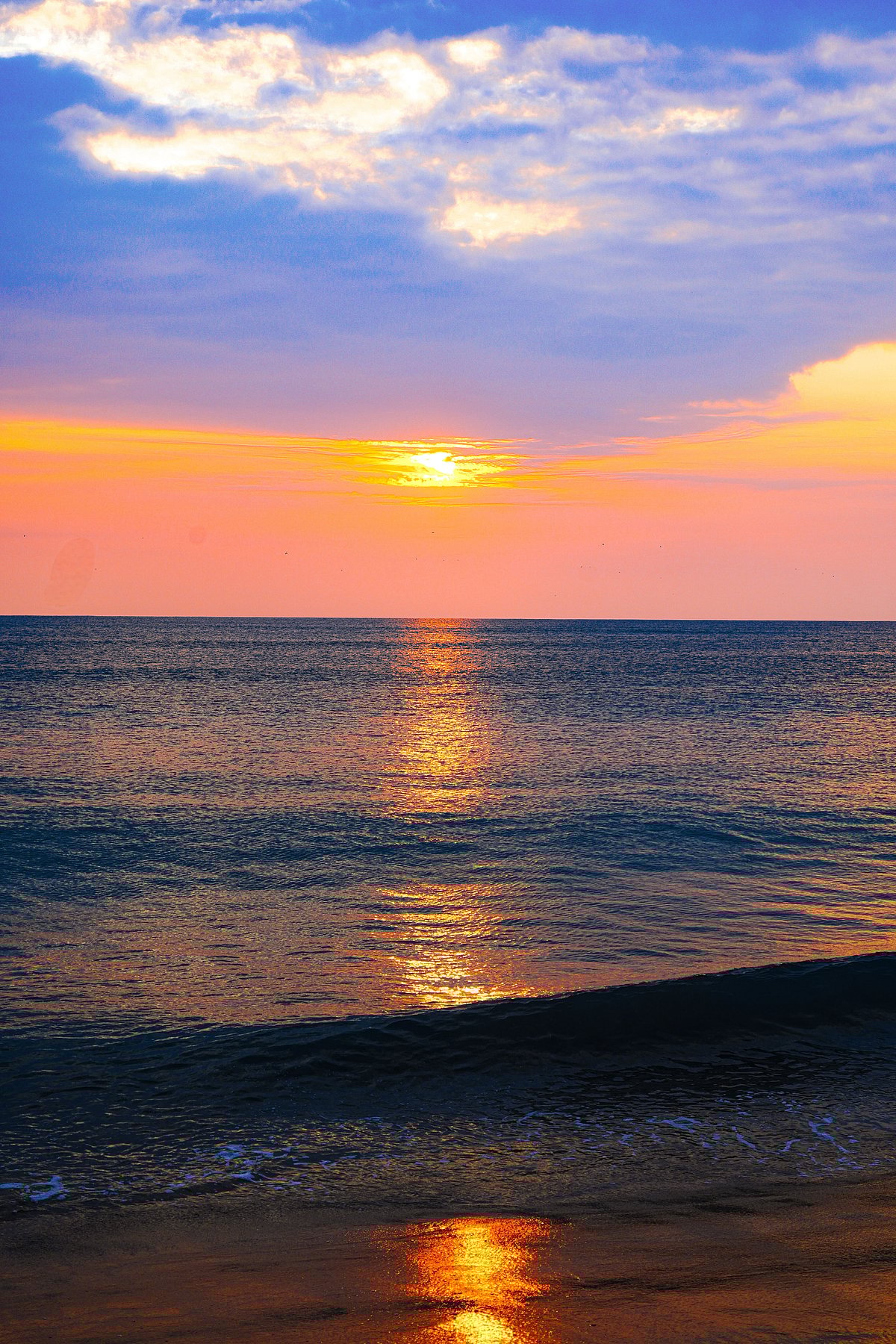 Shutterstock : A fiery sunset at Dhanushkodi Beach