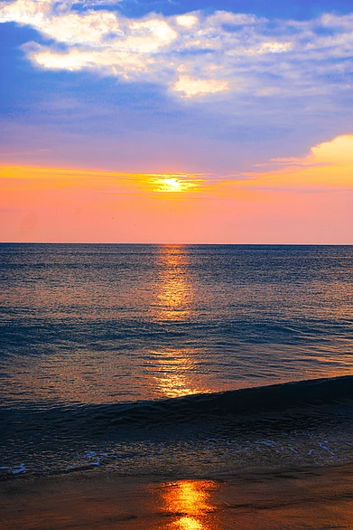 Shutterstock : A fiery sunset at Dhanushkodi Beach