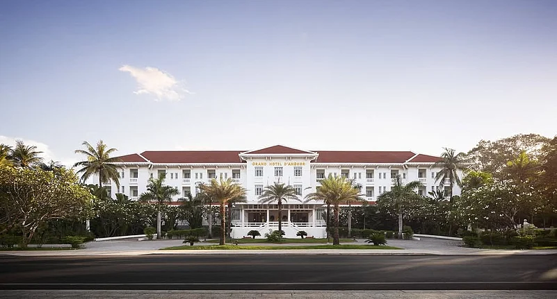 The hotel features French Art Deco architecture combined with Khmer design elements