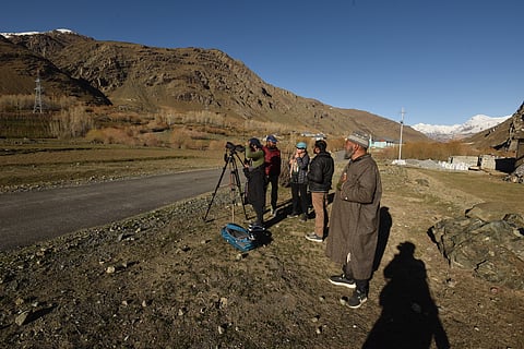 Looking for Brown bears through Ghulam Hasan's scope - Ghulam is in red jacket