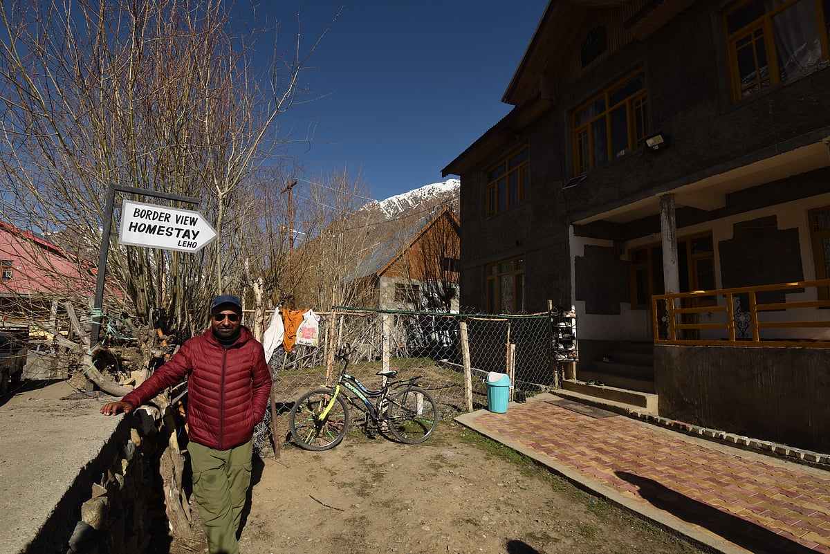 Ghulam Hasan outside Border View Homestay, Mushkoh village