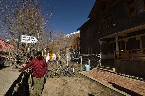 Ghulam Hasan outside Border View Homestay, Mushkoh village