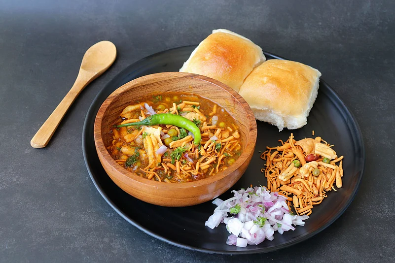 Misal pav consists of a vegetable curry (mostly made from moth beans) an Indian bread roll