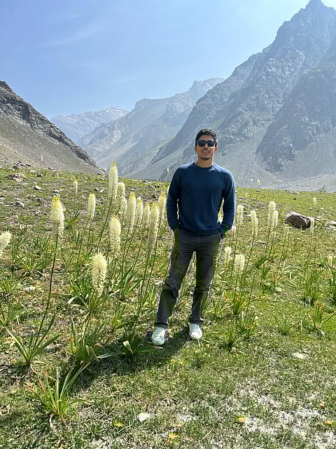 Niazul Hassan Khan in a field of Himalayan foxtail lilies