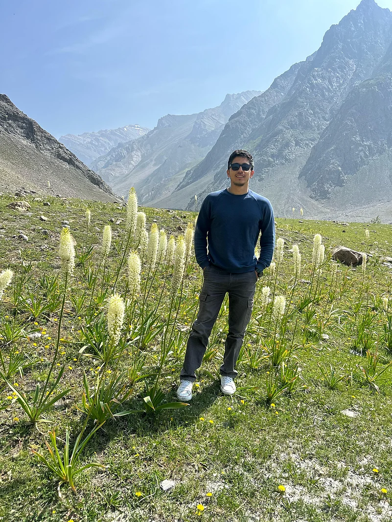 Niazul Hassan Khan in a field of Himalayan foxtail lilies