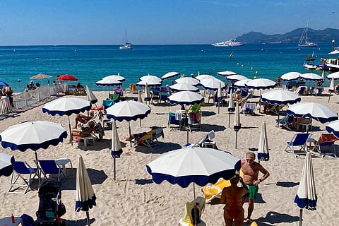 People stick to the beach as heatwaves continue in Europe