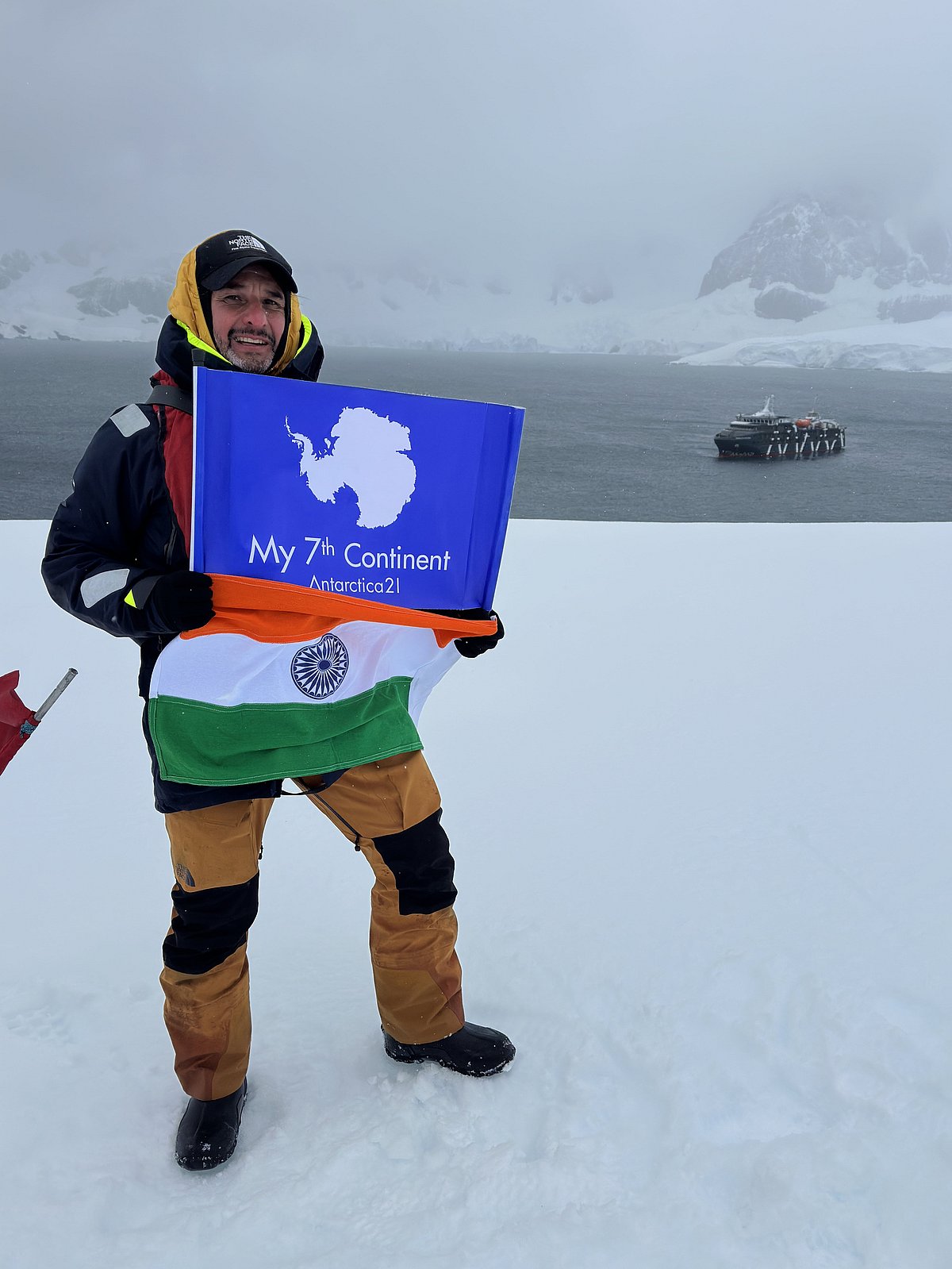 Juan Cristóbal del Pedregal Bravo holding the Indian flag in Antarctica. It was brought by a group of travellers with Antarctica21