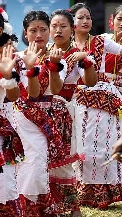 Women and girls from the 'Mising' tribe in Assam perform a dance