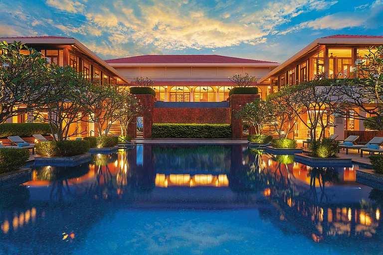 Relax by one of the four outdoor pools at Hilton Goa Resort as you take in the beautiful sunset views of the area - null