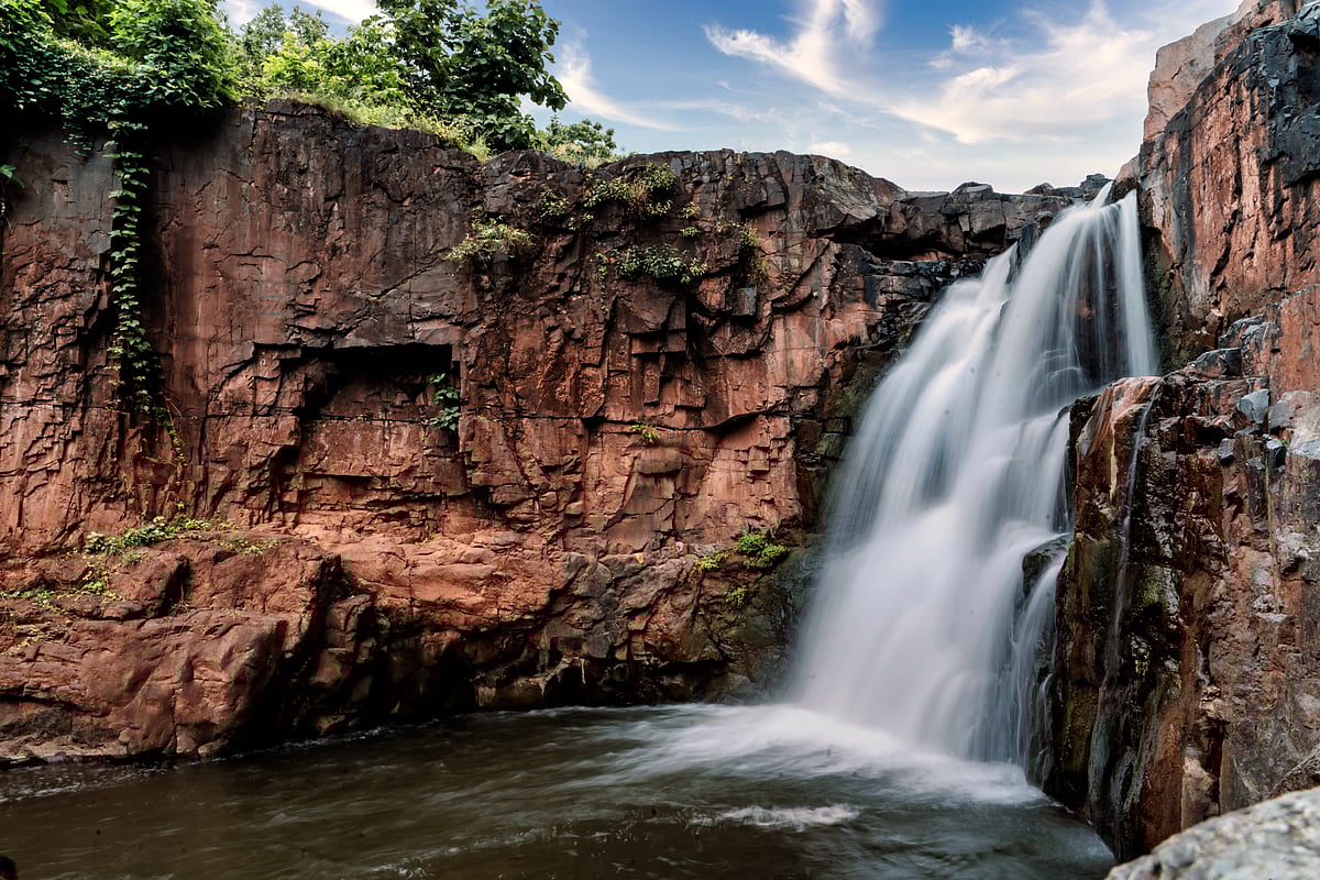 Zarwani Waterfall Cascading down the Rocks Image. 