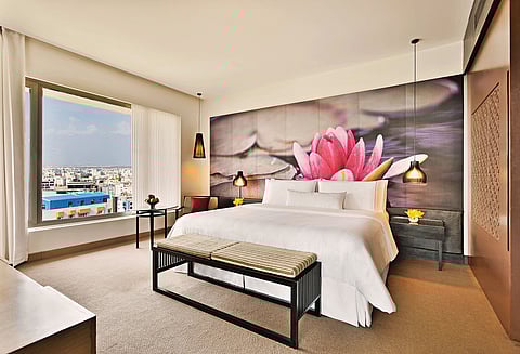 Guests enjoy calming in-room environments with spa access and wellness amenities