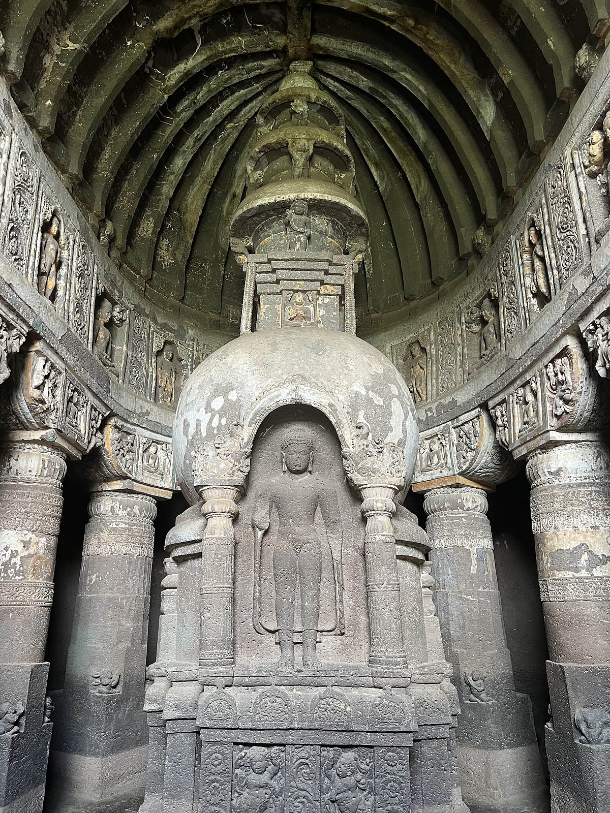 Cave 19 in Ajanta has an ornate carving of the Buddha on the stupa
