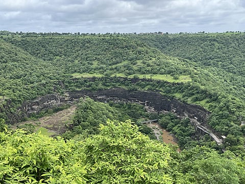 The Ajanta Caves sit on a horseshoe-shaped plateau in Maharashtra