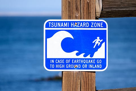 During a tsunami warning, you should evacuate to a location at least 100 feet above sea level or several miles inland