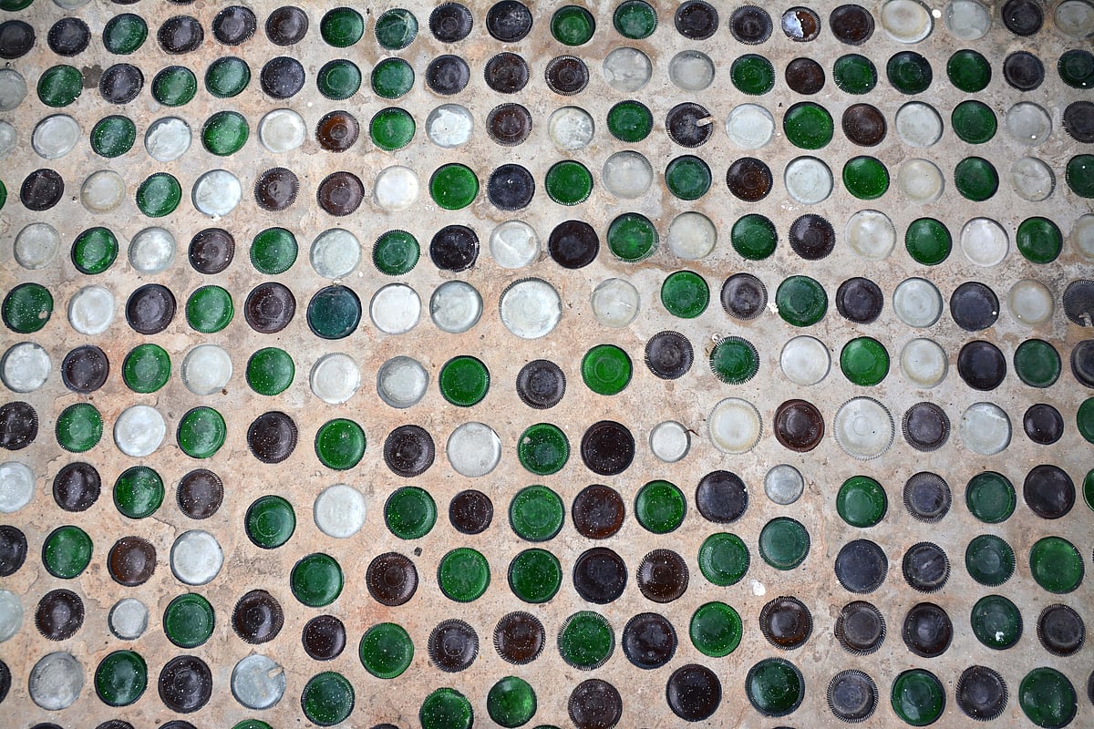 Beer bottles have been embedded in the walls and pillars of Wat Pa Maha Chedi Kaew