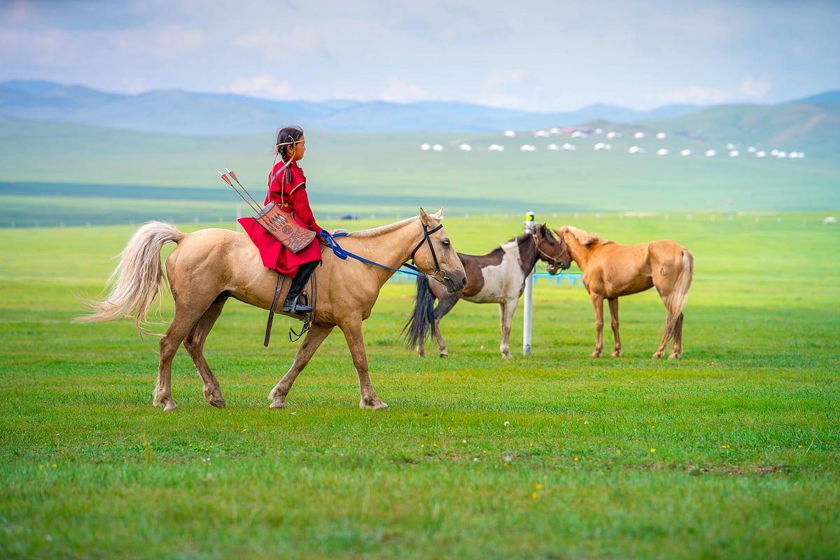 A Mongolian girl on horseback during the Eriin Gurvan Naadam festival