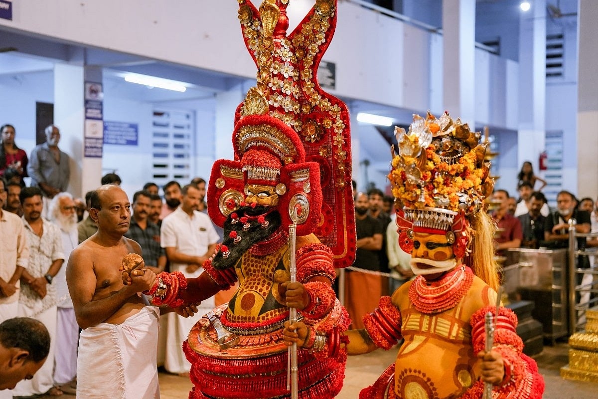 Members of the Vannan community perform the theyyam at the Parassini Madappura Sree Muthappan temple
