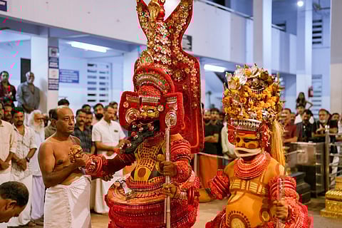 Members of the Vannan community perform the theyyam at the Parassini Madappura Sree Muthappan temple