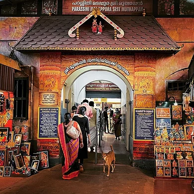 nidhin_kappadan/Instagram : A dog at the entrance of the Parassini Madappura Sree Muthappan temple