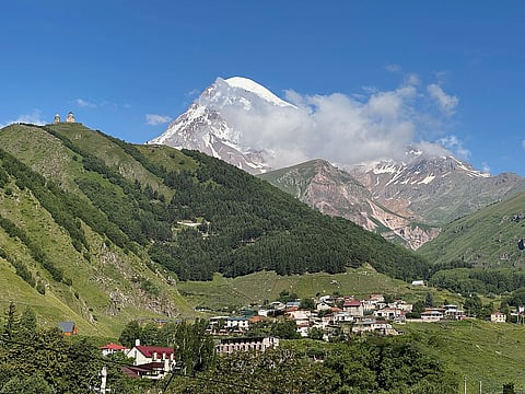 Dominated by the majestic Mount Kazbek and the iconic Gergeti Trinity Church perched high above, the town blends natural grandeur with spiritual heritage.