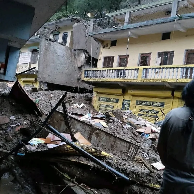 Debris was lodged in the homes and markets of Tharali town on August 22, 2025