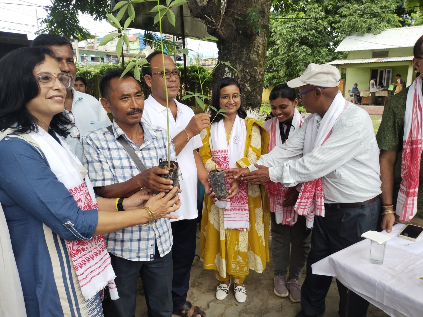 D D Boro, a retired forest officer from Manas National Park, distributes saplings to village heads in the presence of teams from the BNHS and the Forest Department