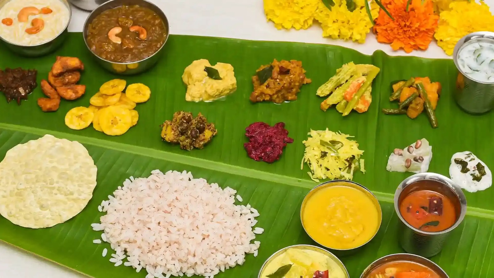 The Sadhya, which is the Onam feast. Served on banana leaf, it features a colourful array of dishes besides the pappadam and other fries—all placed in specific slots