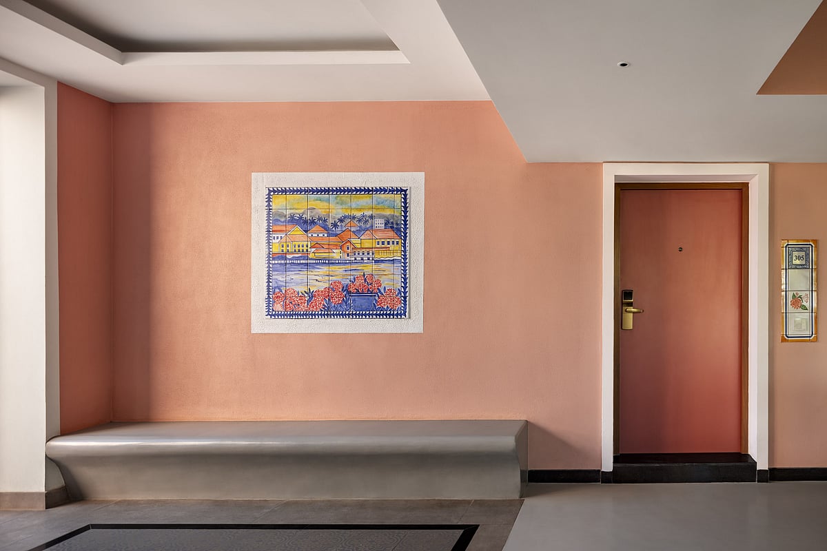 A corridor with a bespoke number plate and art as crafted by Studio IV Designs