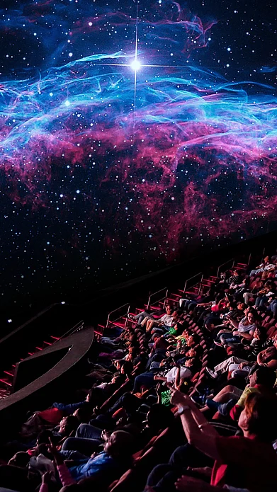 @LibertySciCtr/x : People mesmerised inside a planetarium