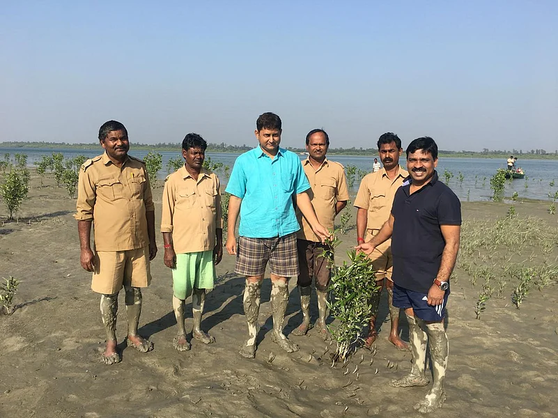 Singaram Kulandaivel, Chief Conservator of Forests, Government of West Bengal, along with his team in the Sundarbans