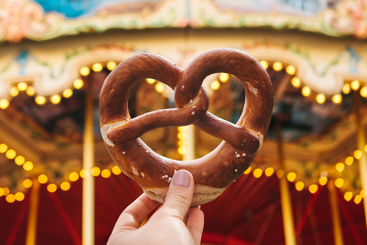 Classic Bavarian bites like soft pretzels set the festive mood long before you reach Munich.