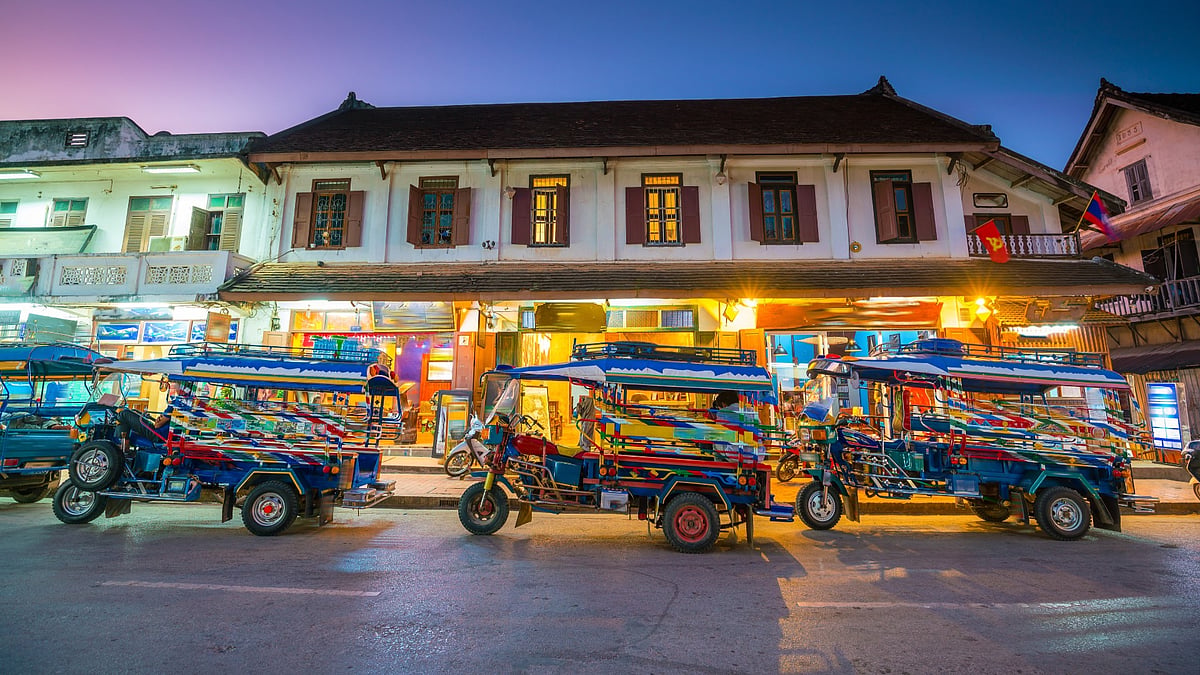Affordable rides in Laos range from colourful tuk-tuks to the high-speed Laos–China Railway. 