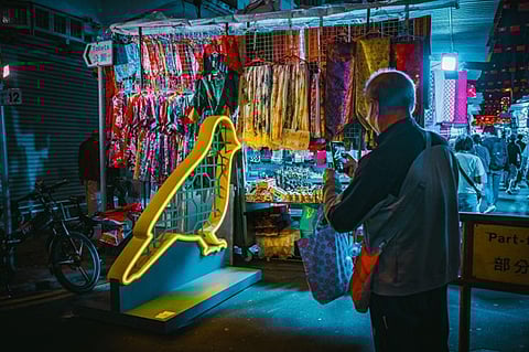 Shop for souvenirs, accessories, and clothes at Temple Street. 