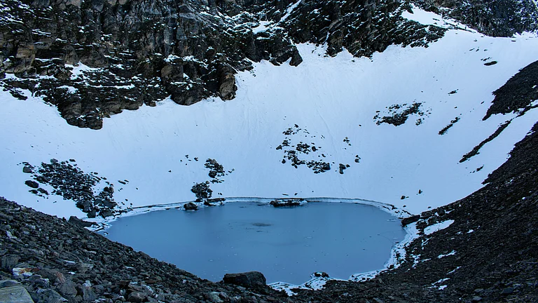Frozen Roopkund Lake, Uttarakhand, in winter - Shutterstock