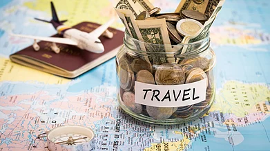Shutterstock : Saving travel money in advance ensures a smooth and budget-friendly international trip