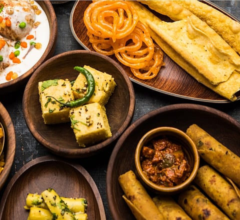 Spinning to the beats, stick in hand, the magic of Garba in full swing