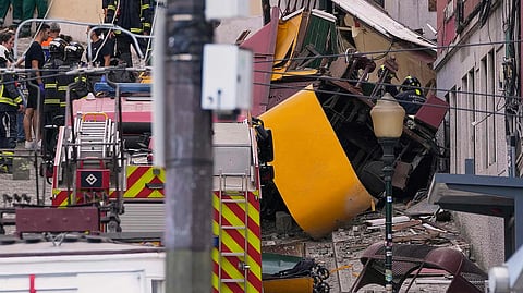 Rescue teams at the site where Lisbon’s Elevador da Glória funicular derailed, killing 15 and injuring 18.