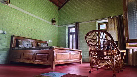 A cozy homestay room in Ladpura Khas, blending rustic charm with comfort and cultural décor