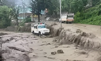 X : The swollen Devalsari stream in Uttarkashi’s Yamuna Valley after Saturday’s cloudburst, which damaged homes and property