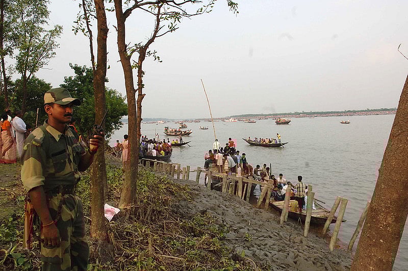 At the river Ichamati, the border between India and Bangladesh where devotees from both sides celebrate the immersion of Goddess Durga