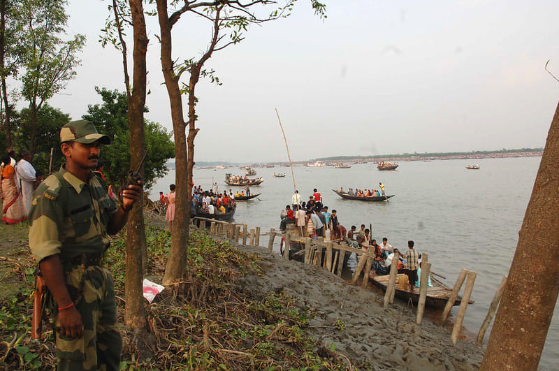 At the river Ichamati, the border between India and Bangladesh where devotees from both sides celebrate the immersion of Goddess Durga