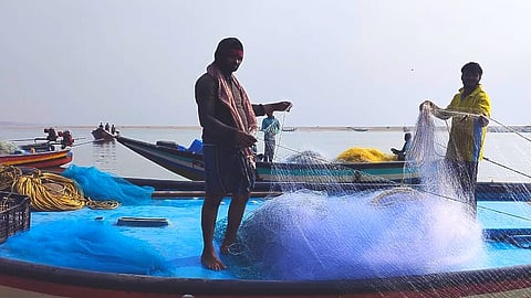 Fishermen prepare their nets in Ganjam, a district where livelihoods are tied to both the bounty and the fury of the sea