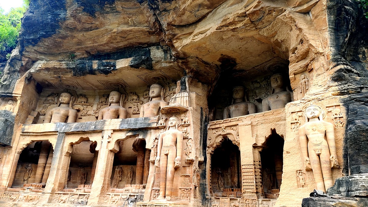 Intricately carved Jain Tirthankara figures grace the rock-cut temples beneath Gwalior Fort’s cliffs