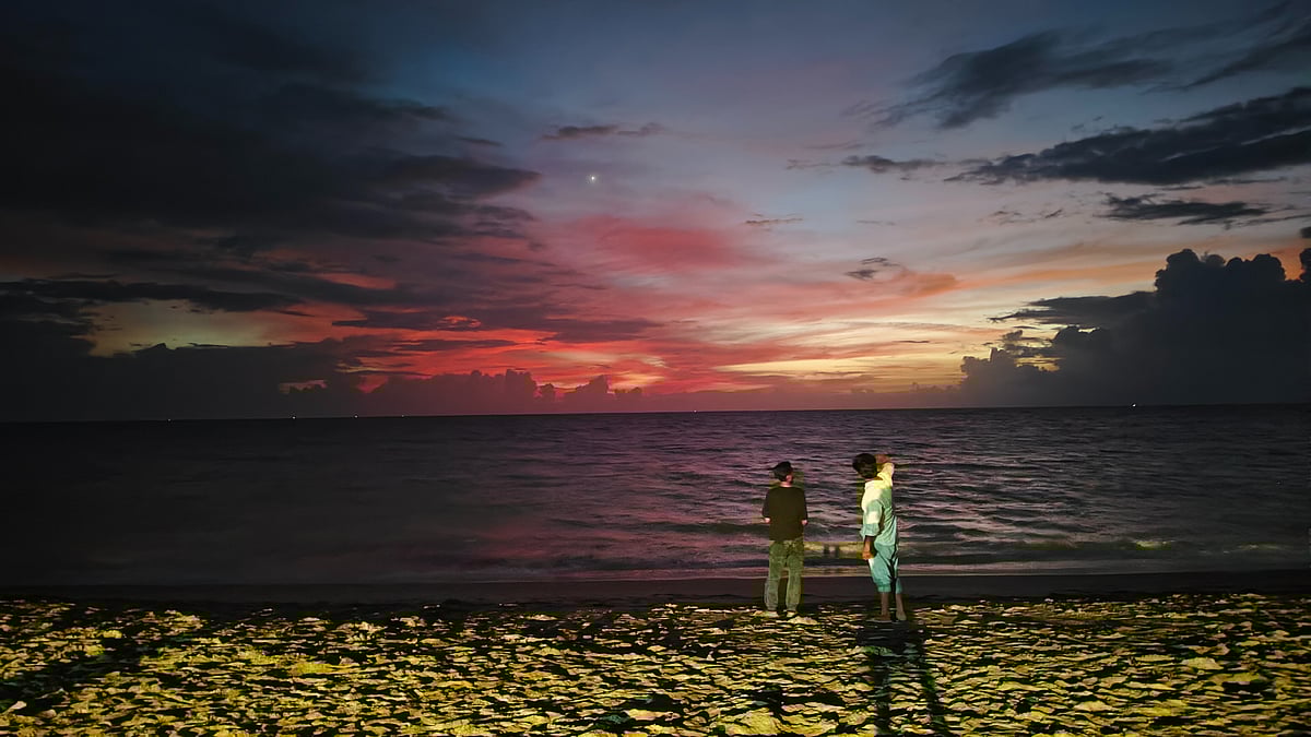 Visitors at a beach in Marari, Kerala