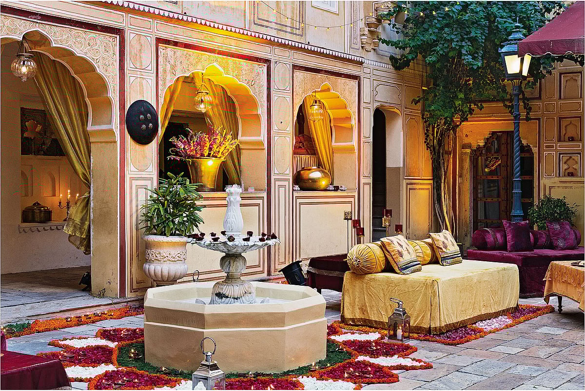 An intimate courtyard dressed in flowers and quiet charm—a perfect milieu for smaller ceremonies, where every moment feels deeply personal