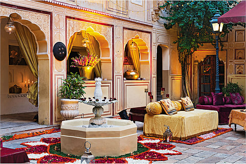 An intimate courtyard dressed in flowers and quiet charm—a perfect milieu for smaller ceremonies, where every moment feels deeply personal