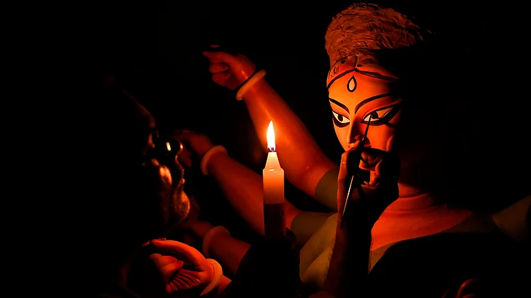 Chokkhu Daan (drawing the Goddess' eye) on Mahalaya - Shutterstock