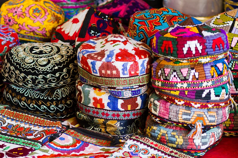 The traditional Uzbek cap, named tubeteika, duppi or kalpoq, decorated with multi colored embroidery. Bukhara, Uzbekistan, Central Asia