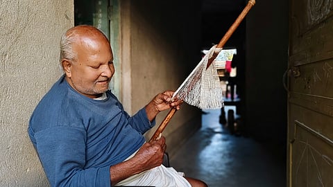 A local man in Azimganj, Murshidabad, knits a fishnet